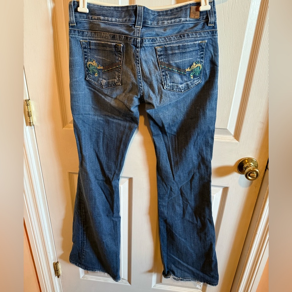 Guess Embroidered Frayed Bootcut Jeans